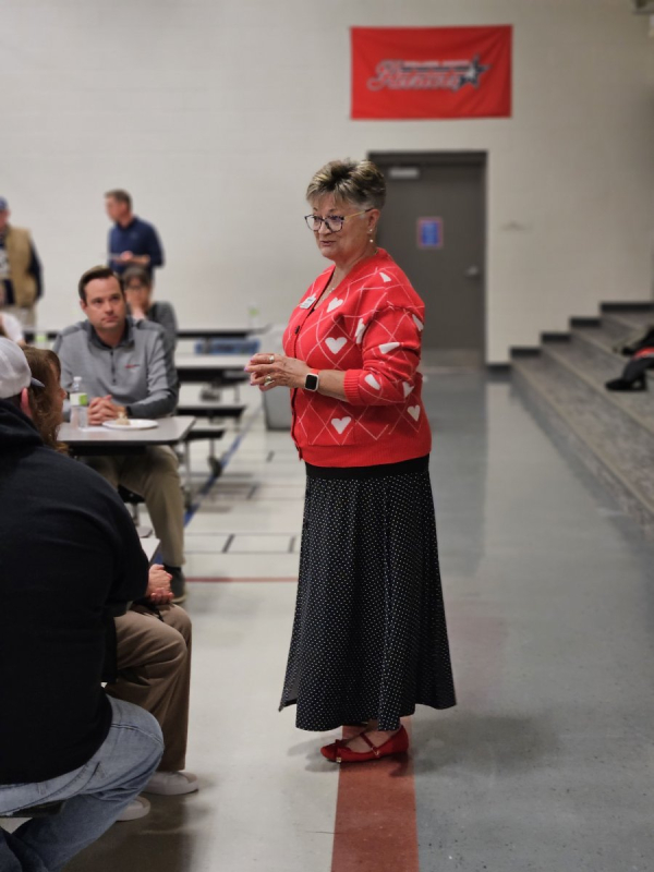Jane Erickson speaking to students and families