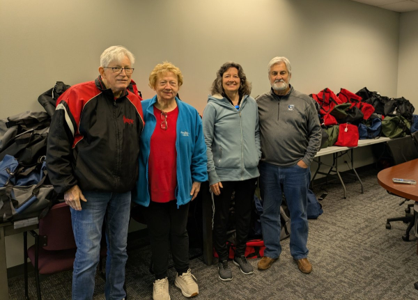 Dick and Sharon Hovorka, Diana Wagner and John Miller dropping off totes at KVC